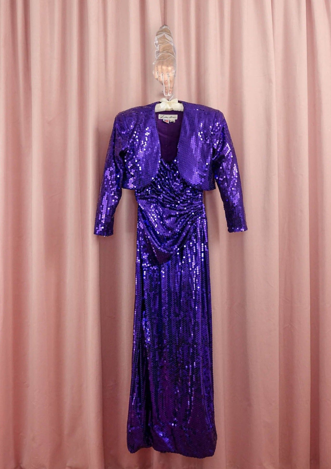 lillie rubin sequin dress Vintage Lillie Rubin You're sure to turn heads in this stunning vintage Lillie Rubin dress. The dramatic low back and intricate beading create an elegant yet sultry silhouette perfect